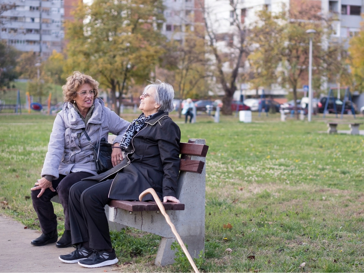 Senior with caregiver managing Alzheimer's in North Vancouver home